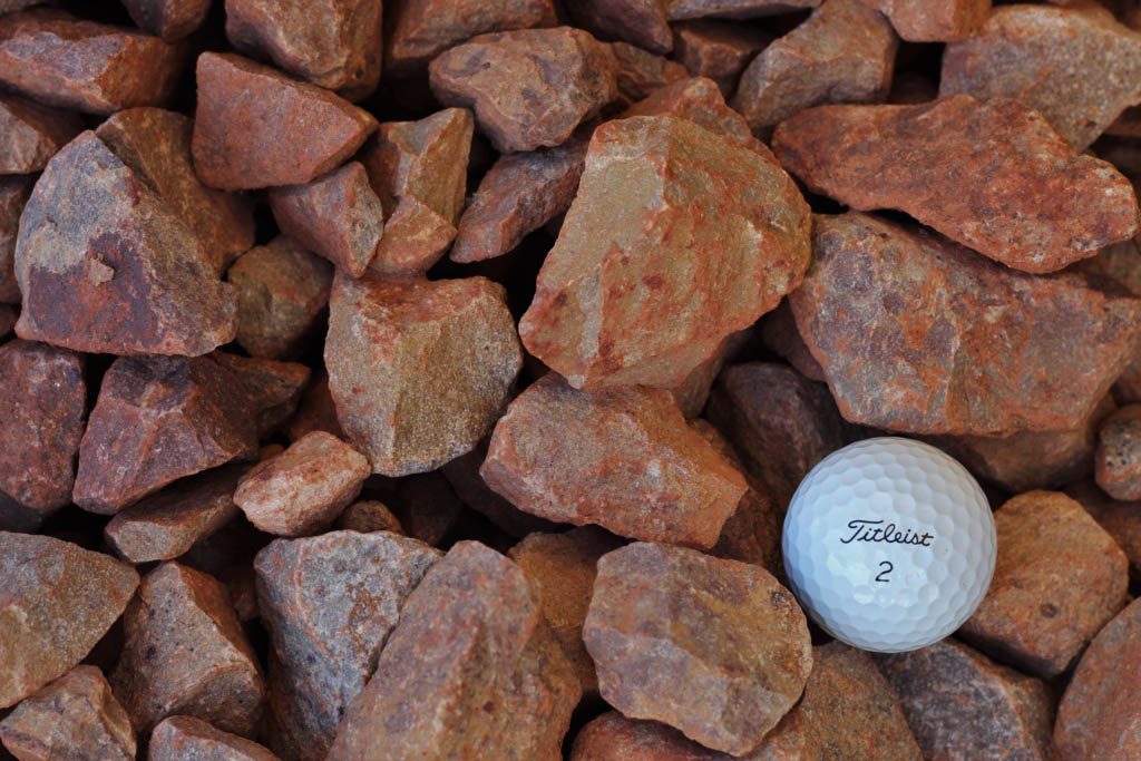 Numerous reddish-brown jagged dakota badlands stones.